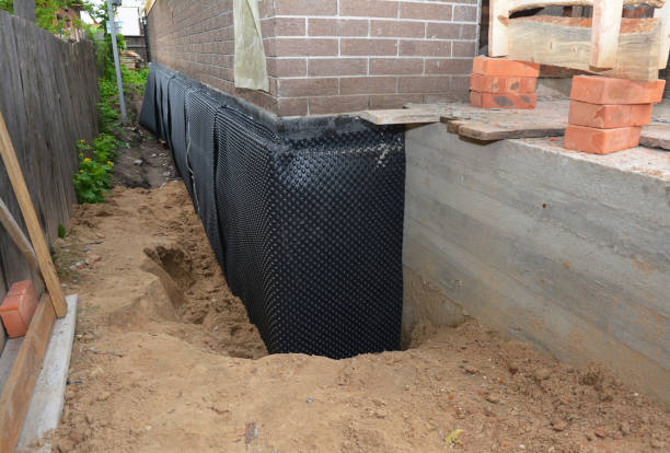 SJ Waterproofing Pros technician performing targeted Basement Waterproofing assessment in Great Falls, VA